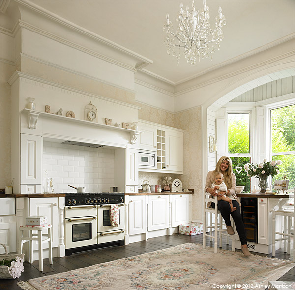 Amanda Cunningham with her baby Oliver in the kitchen of their renovated double fronted mid terrace home in Belfast.